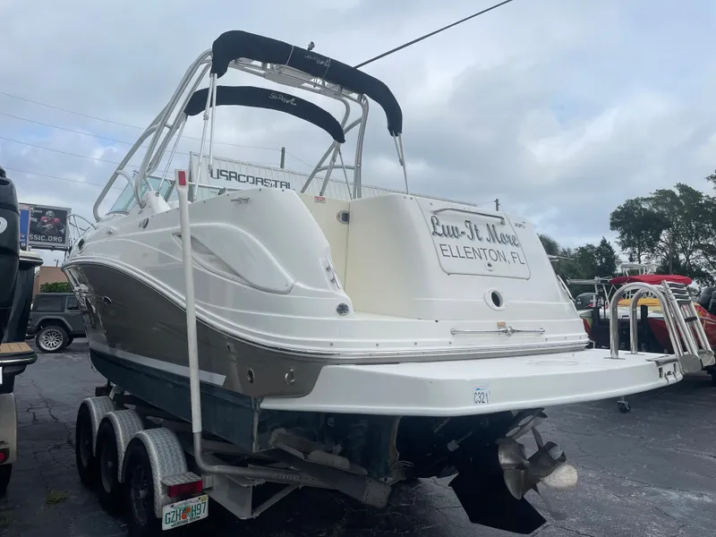Slide: The Image of 2006 Sea Ray 270 Amberjack boat on trailer, rear view, overcast sky. - 10