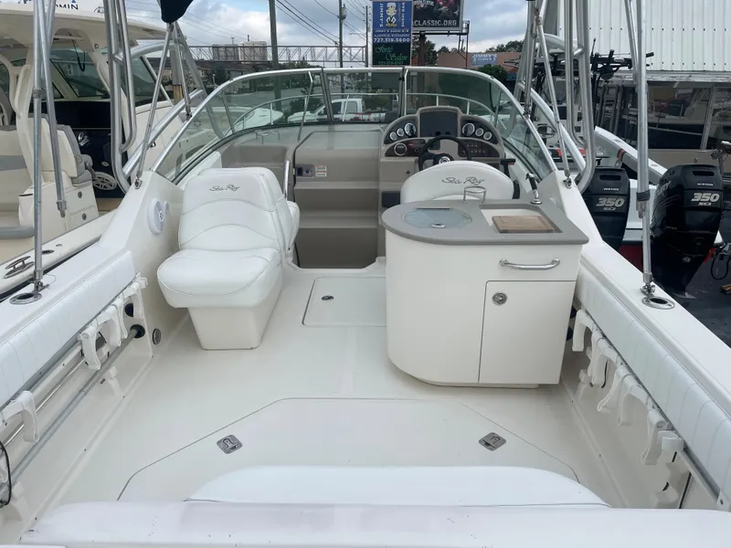 Slide: The Image of 2006 Sea Ray 270 Amberjack boat interior with seating and helm. - 13
