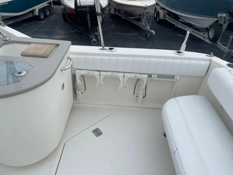 Slide: The Image of Interior view of 2006 Sea Ray 270 Amberjack boat with seating and storage. - 18