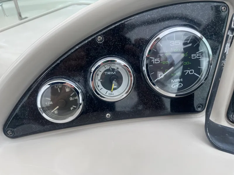 Slide: The Image of Dashboard gauges of 2006 Sea Ray 270 Amberjack boat, showing speedometer and trim indicators. - 25