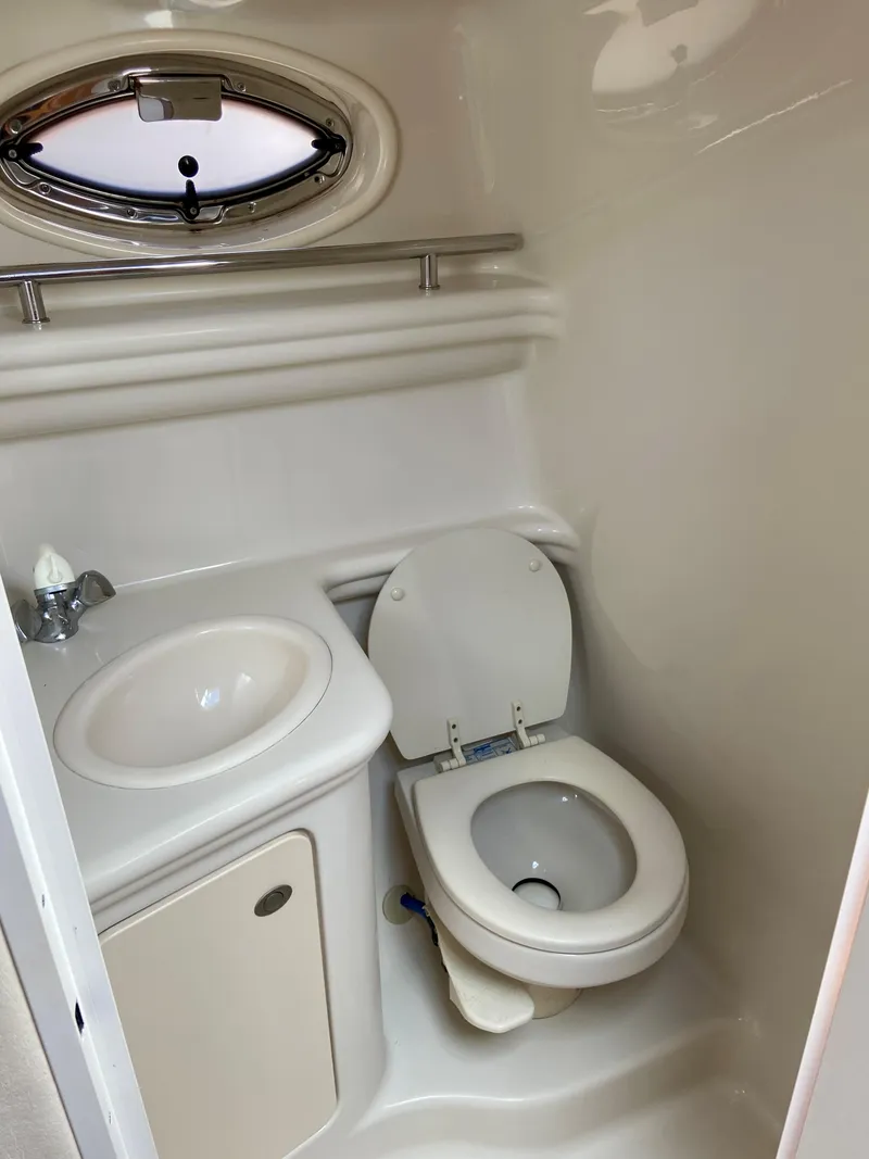 Slide: The Image of 2006 Sea Ray 270 Amberjack bathroom with sink and toilet. - 30