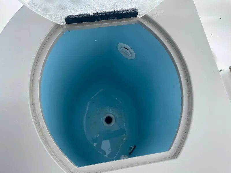 Slide: The Image of Open hatch of 2006 Sea Ray 270 Amberjack boat, showing interior compartment. - 32