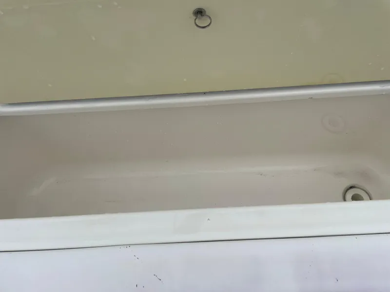 Slide: The Image of Open storage compartment on 2006 Sea Ray 270 Amberjack boat. - 34