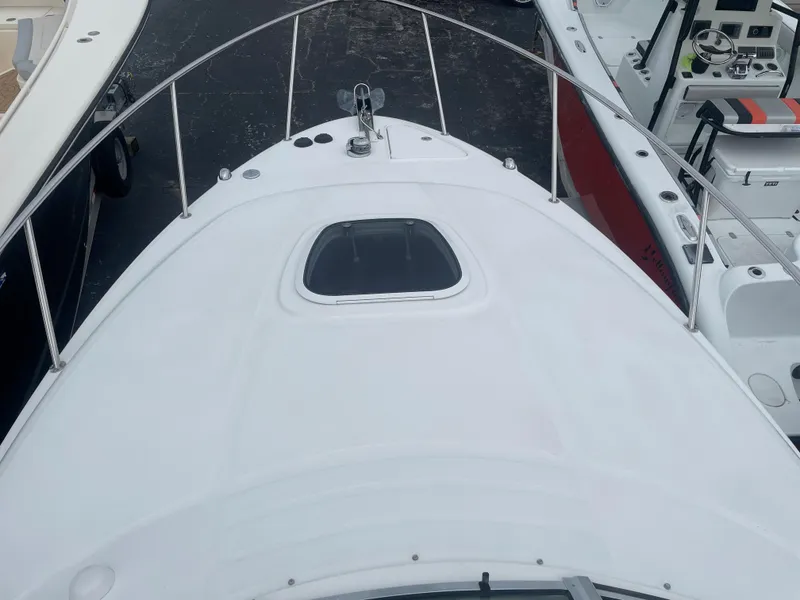 Slide: The Image of 2006 Sea Ray 270 Amberjack boat deck with hatch and railing. - 36