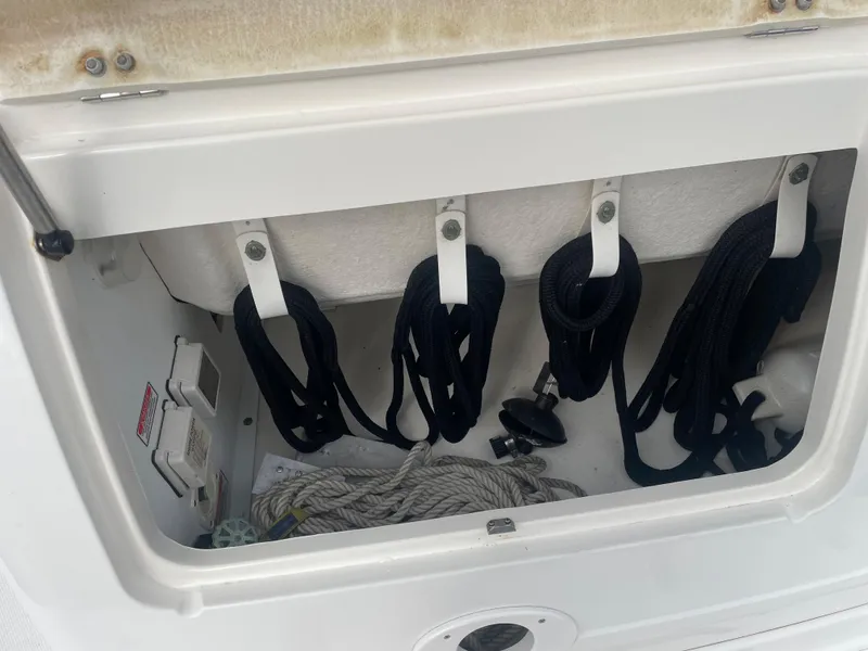 Slide: The Image of Storage compartment with ropes on a 2006 Sea Ray 270 Amberjack boat. - 41