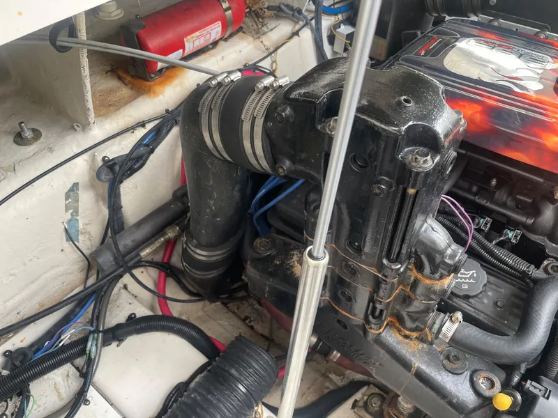 Slide: The Image of Engine compartment of a 2006 Sea Ray 270 Amberjack boat, showing mechanical components and wiring. - 47