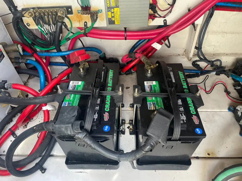 Slide: The Image of Batteries and wiring in 2006 Sea Ray 270 Amberjack boat. - 49