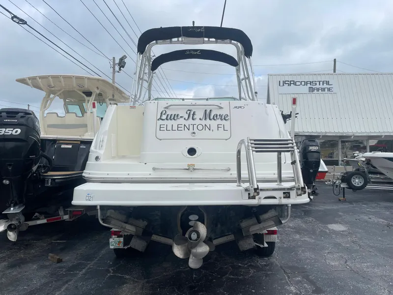 Slide: The Image of 2006 Sea Ray 270 Amberjack boat at a marina, rear view. - 9