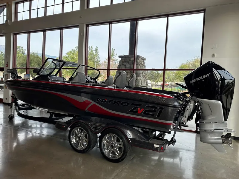 Slide: The Image of 2023 Nitro ZV21 Pro boat with Mercury engine in showroom. - 1