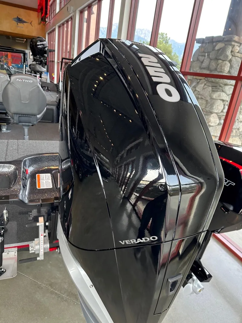 Slide: The Image of 2023 Nitro ZV21 Pro boat with a powerful Verado outboard motor in showroom. - 3