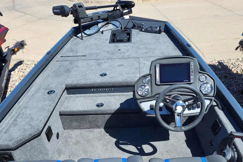 Slide: The Image of 2023 Ranger RT178 boat interior with steering console and navigation system. - 2