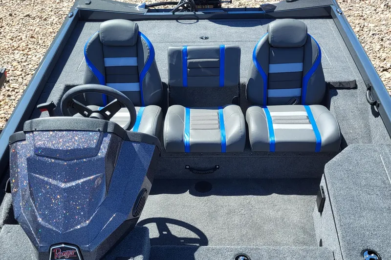 Slide: The Image of 2023 Ranger RT178 boat interior with blue and gray seats. - 5
