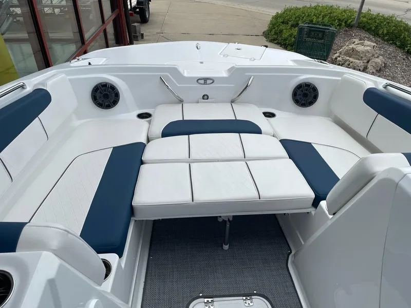 Slide: The Image of 2023 Tahoe 1950 boat interior with white and blue seating. - 7