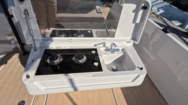 Slide: The Image of RYCK 280 boat kitchenette with stove and sink, 2023 model. - 13
