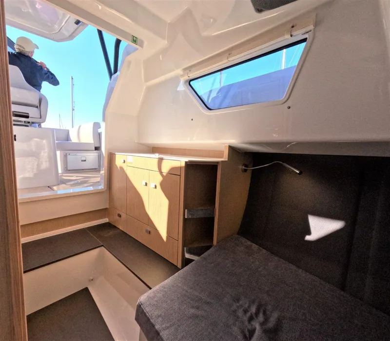 Slide: The Image of Interior cabin of 2023 RYCK 280 boat with seating and storage. - 15