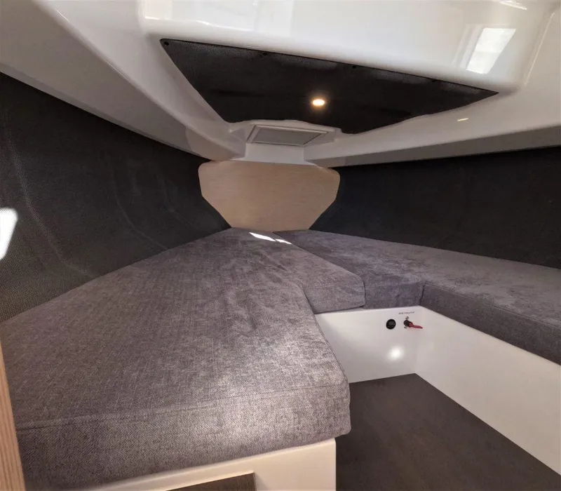 Slide: The Image of Interior cabin of 2023 RYCK 280 boat with gray upholstery and modern design. - 16