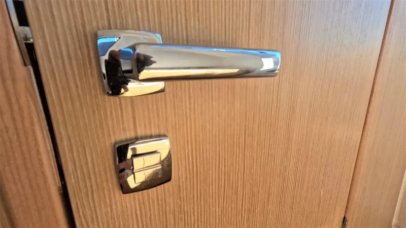 Slide: The Image of Chrome door handle on wooden surface, RYCK 280, 2023 model. - 17