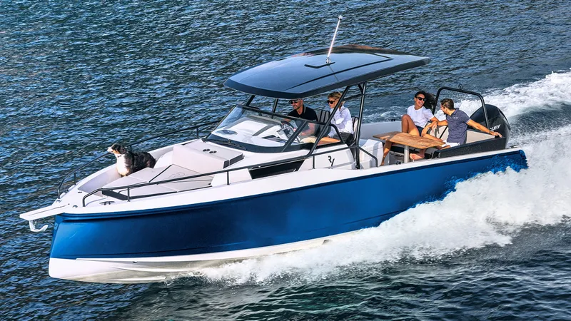 Slide: The Image of 2023 RYCK 280 boat cruising with passengers and a dog on the water. - 2