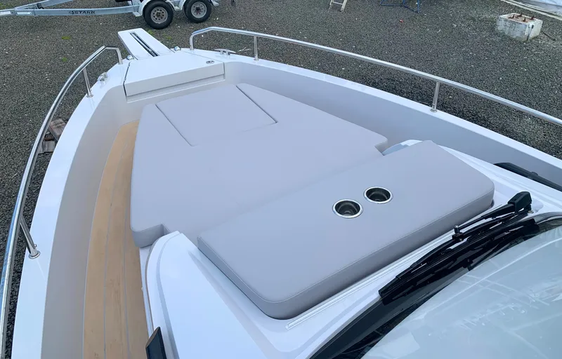 Slide: The Image of RYCK 280 boat deck, 2023 model, featuring cushioned seating and sleek design. - 20