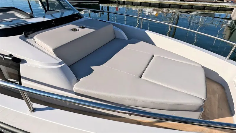 Slide: The Image of 2023 RYCK 280 boat with cushioned sunbathing area on deck. - 22