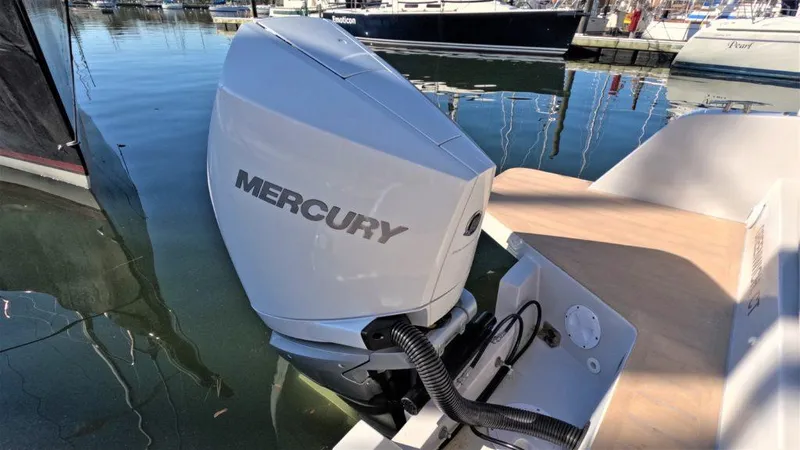 Slide: The Image of Mercury outboard motor on 2023 RYCK 280 boat, docked in marina. - 25