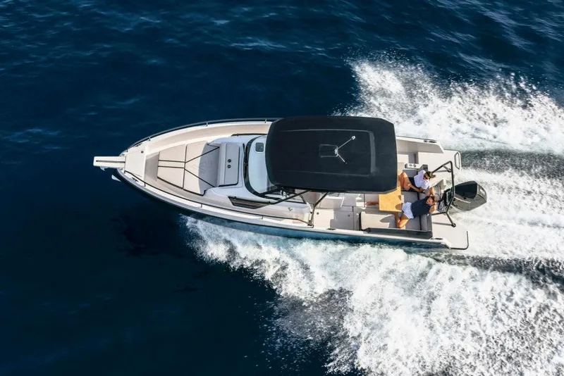 Slide: The Image of 2023 RYCK 280 boat cruising on open water, aerial view. - 26
