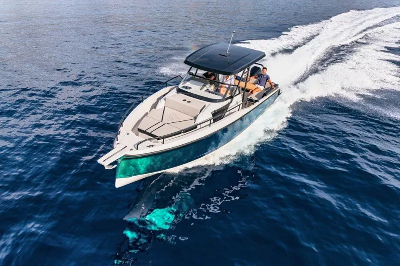 Slide: The Image of 2023 RYCK 280 boat cruising on open blue water. - 28