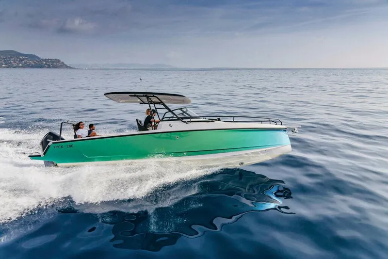 Slide: The Image of 2023 RYCK 280 boat cruising on open water under clear skies. - 4