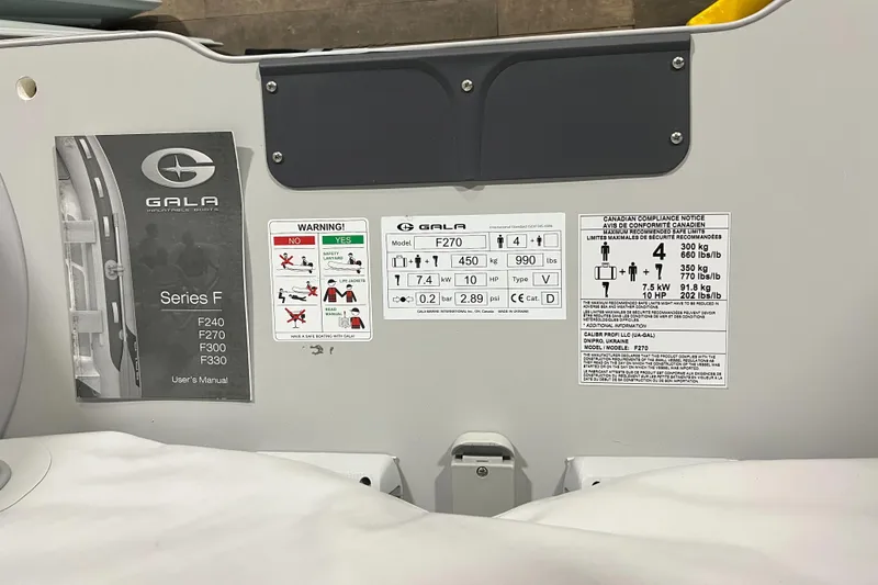 Slide: The Image of Gala F270A 2023 model specifications and safety instructions on a boat interior. - 3