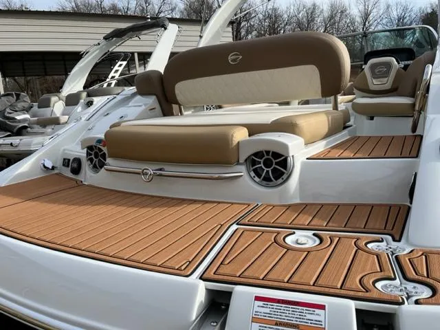 Slide: The Image of 2023 Crownline 290 SS boat with teak deck and cushioned seating. - 1