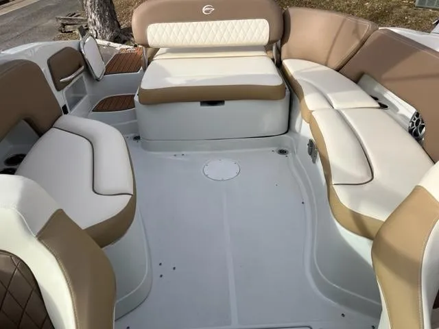 Slide: The Image of 2023 Crownline 290 SS boat interior with beige and white seating. - 6