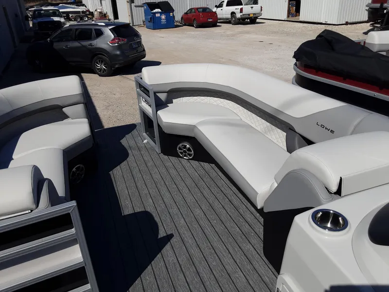 Slide: The Image of 2023 Lowe SS 230 pontoon boat with spacious seating and modern design. - 3