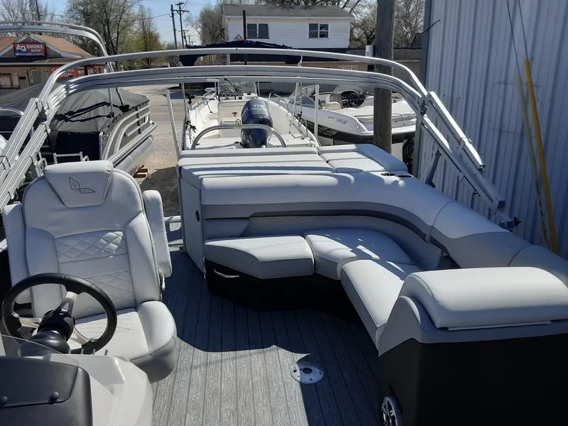 Slide: The Image of 2023 Lowe SS 230 pontoon boat with spacious seating and modern design. - 5