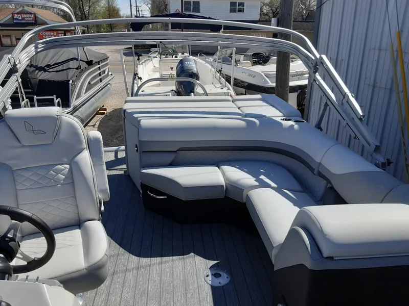 Slide: The Image of 2023 Lowe SS 230 pontoon boat with luxurious seating and modern design. - 6