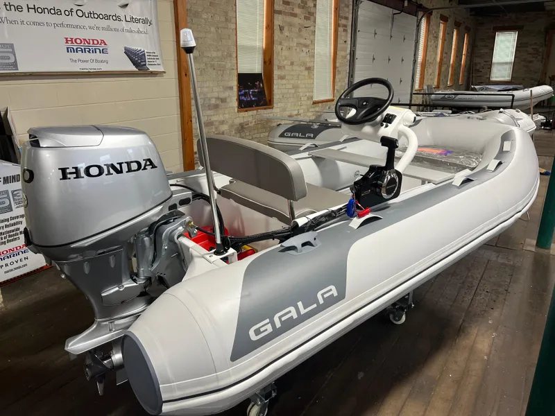 The Image of 2023 Gala A330Q inflatable boat with Honda outboard motor in showroom. - 0