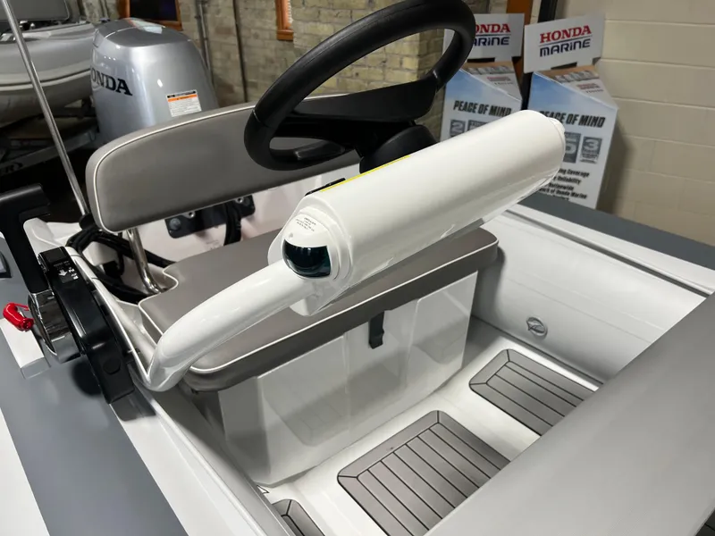 Slide: The Image of Gala A330Q 2023 model boat interior with steering wheel and storage compartment. - 9