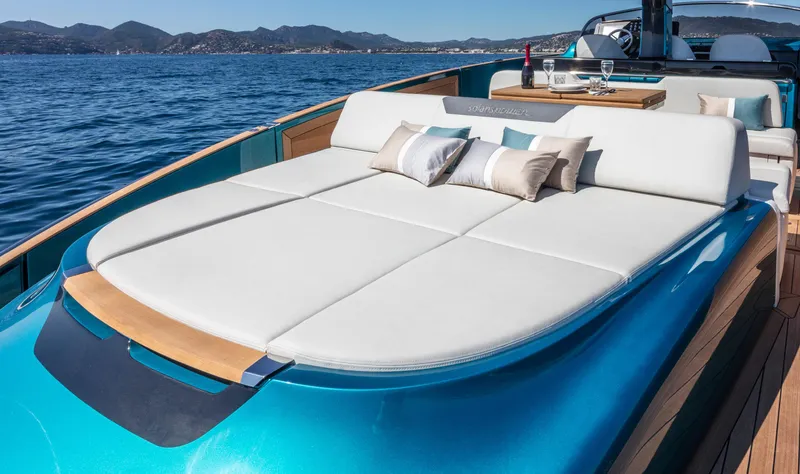 Slide: The Image of Luxurious 2025 Solaris Power 48 OPEN yacht with sunbed, cruising on serene waters. - 5