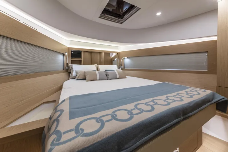 Slide: The Image of Luxurious cabin interior of 2025 Solaris Power 48 OPEN yacht with elegant bedding. - 12