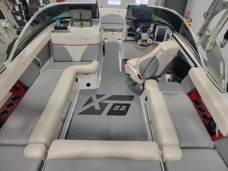 Slide: The Image of Interior of 2018 MasterCraft XT22 boat with seating and steering wheel. - 20