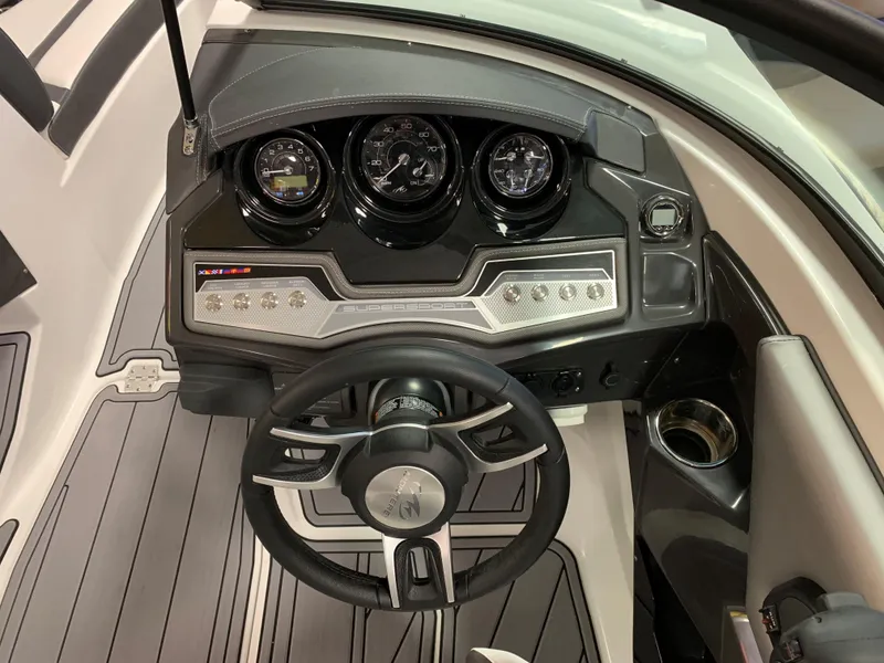 Slide: The Image of 2023 Monterey 218 Super Sport dashboard with steering wheel and instrument panel. - 10
