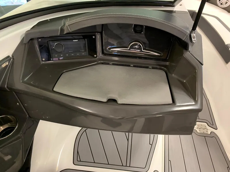 Slide: The Image of 2023 Monterey 218 Super Sport boat dashboard with modern controls and sleek design. - 12
