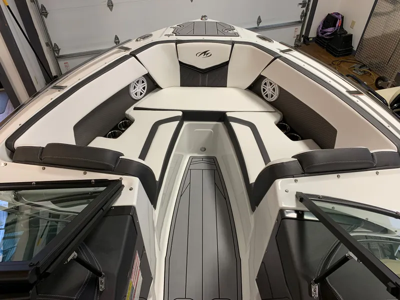 Slide: The Image of 2023 Monterey 218 Super Sport boat interior with sleek seating and modern design. - 7