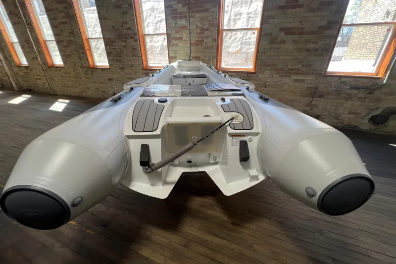 Slide: The Image of Inflatable boat Gala V360 2026 model in a sunlit room with brick walls. - 6