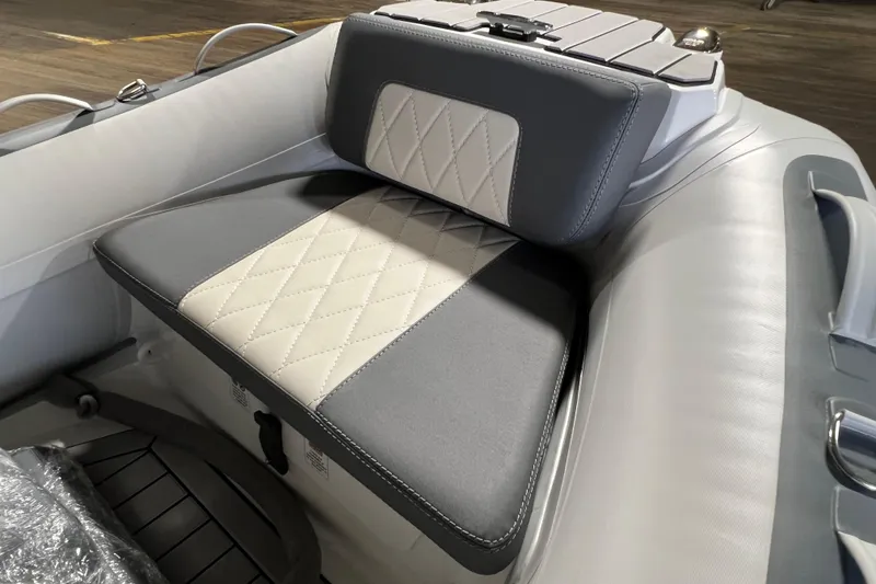 Slide: The Image of Gala V360 2026 boat seat with diamond-stitched upholstery in gray and white. - 7