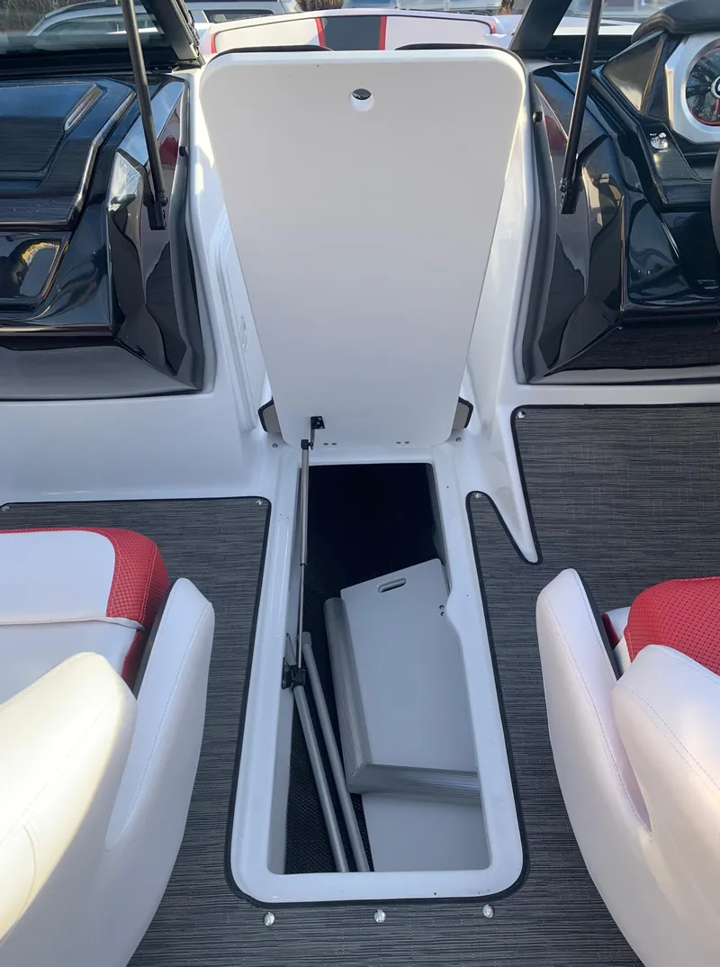 Slide: The Image of 2023 Scarab 195 ID boat interior storage compartment. - 12