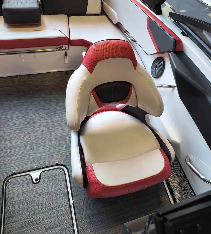 Slide: The Image of 2023 Scarab 195 ID boat interior with red and white seating. - 13