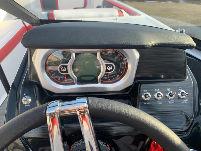 Slide: The Image of Dashboard of 2023 Scarab 195 ID boat with steering wheel and control panel. - 18