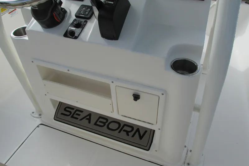 Slide: The Image of 2023 Sea Born LX22 Center Console dashboard with storage and cup holders. - 10
