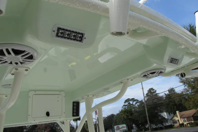 Slide: The Image of 2023 Sea Born LX22 Center Console boat roof with speakers and lights. - 13