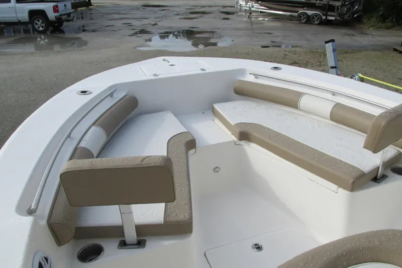 Slide: The Image of 2023 Sea Born LX22 Center Console boat with spacious seating area. - 23